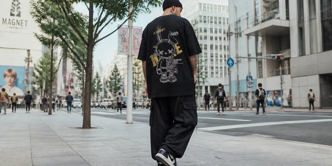 A stylish Japanese streetwear man wearing a mecha rabbit graphic tee.